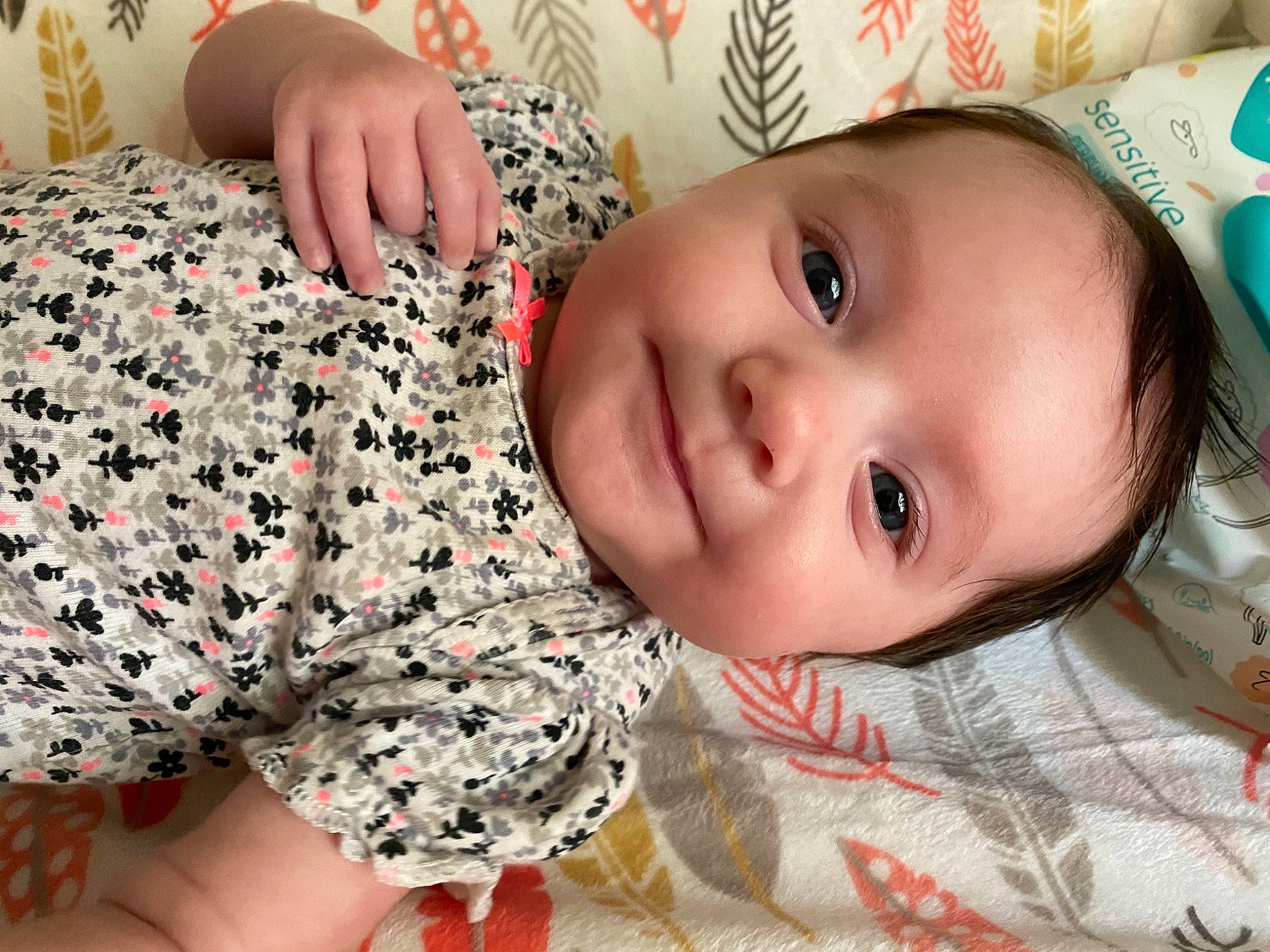 Makenzie is registered to the contest to win money with this photo: baby, baby_toddler_clothing, cheek, child, eye, face, finger, happy, head, joy, lip, mouth, nose, pattern, person, skin, smile, toddler