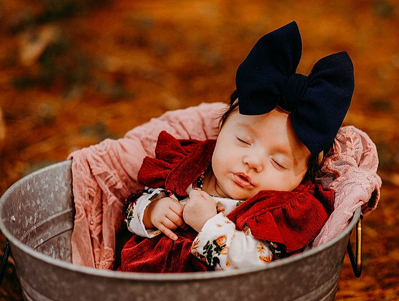 Makenzie joined the competition — help win amazing prizes! autumn, baby, cheek, child, ear, happy, headgear, headwear, leaf, person, photography, plant, red, skin, smile, toddler