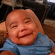 Antonio joined the competition — help win amazing prizes! baby, smiling, blue_clothing, indoor, living_room, furniture, heart_overlay, cute, portrait, child, happy, infant, tattoo, carpet, window, curtains, lamp, playful, selfie, closeup