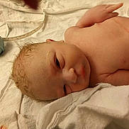 Hayden joined the competition — help win amazing prizes! baby, newborn, infant, blanket, towel, hospital, suction_bulb, measuring_tape, umbilical_clamp, wet_hair, face, eyes, nose, chest, arm, skin, lying_on_back, medical, hospital_bed, newborn_care