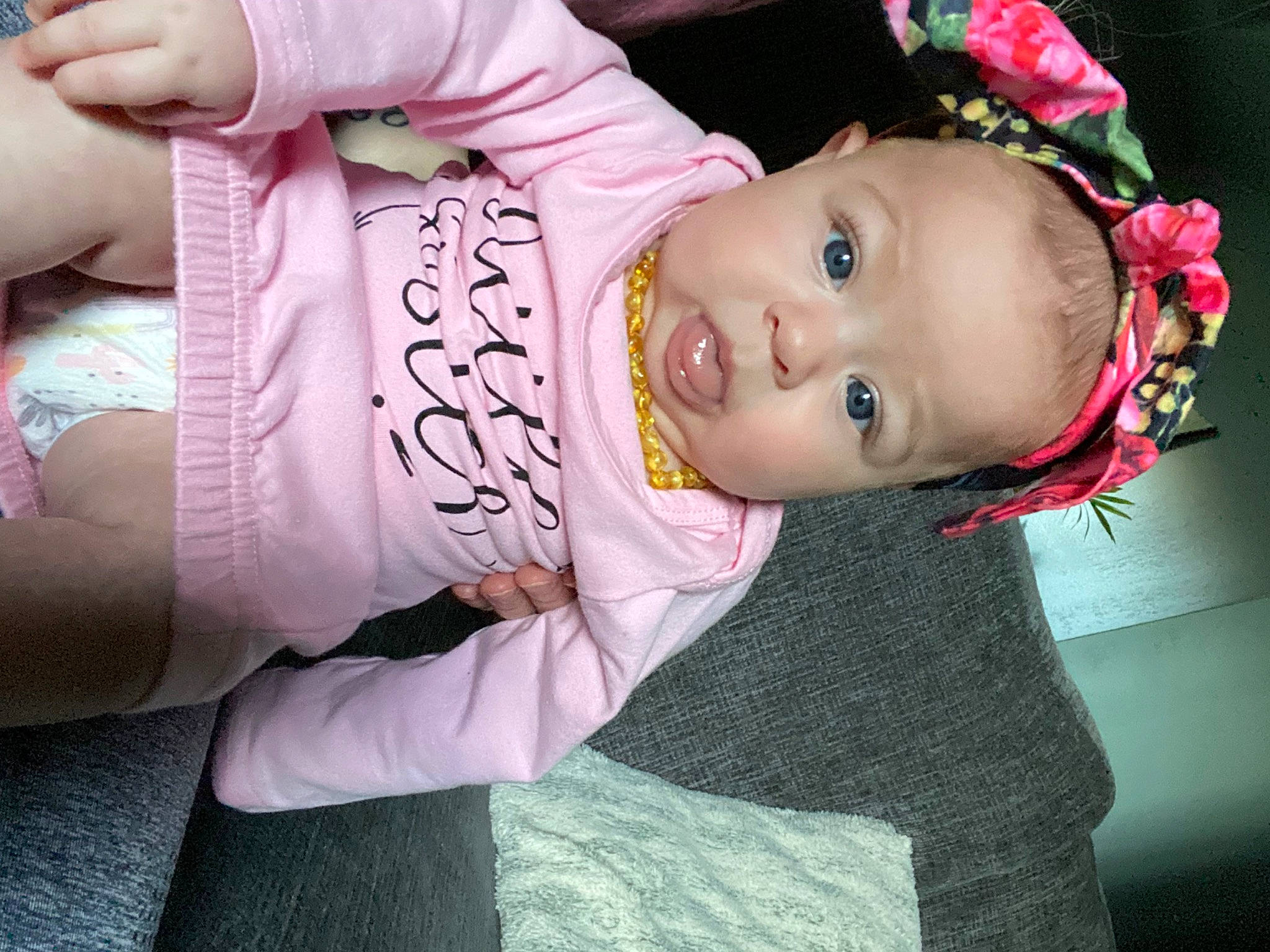 Kaia is registered to the contest to win money with this photo: baby, baby_toddler_clothing, cheek, child, eye, flash_photography, happy, headgear, human_body, iris, lip, magenta, mouth, nose, person, pink, skin, sleeve, smile, toddler