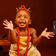 Ava joined the competition — help win amazing prizes! accessories, baby, babylaughing, bodypart, clothing, dress, face, finger, formalwear, hand, happy, head, jewelry, laughing, necklace, person, photography, portrait, smile, wrist