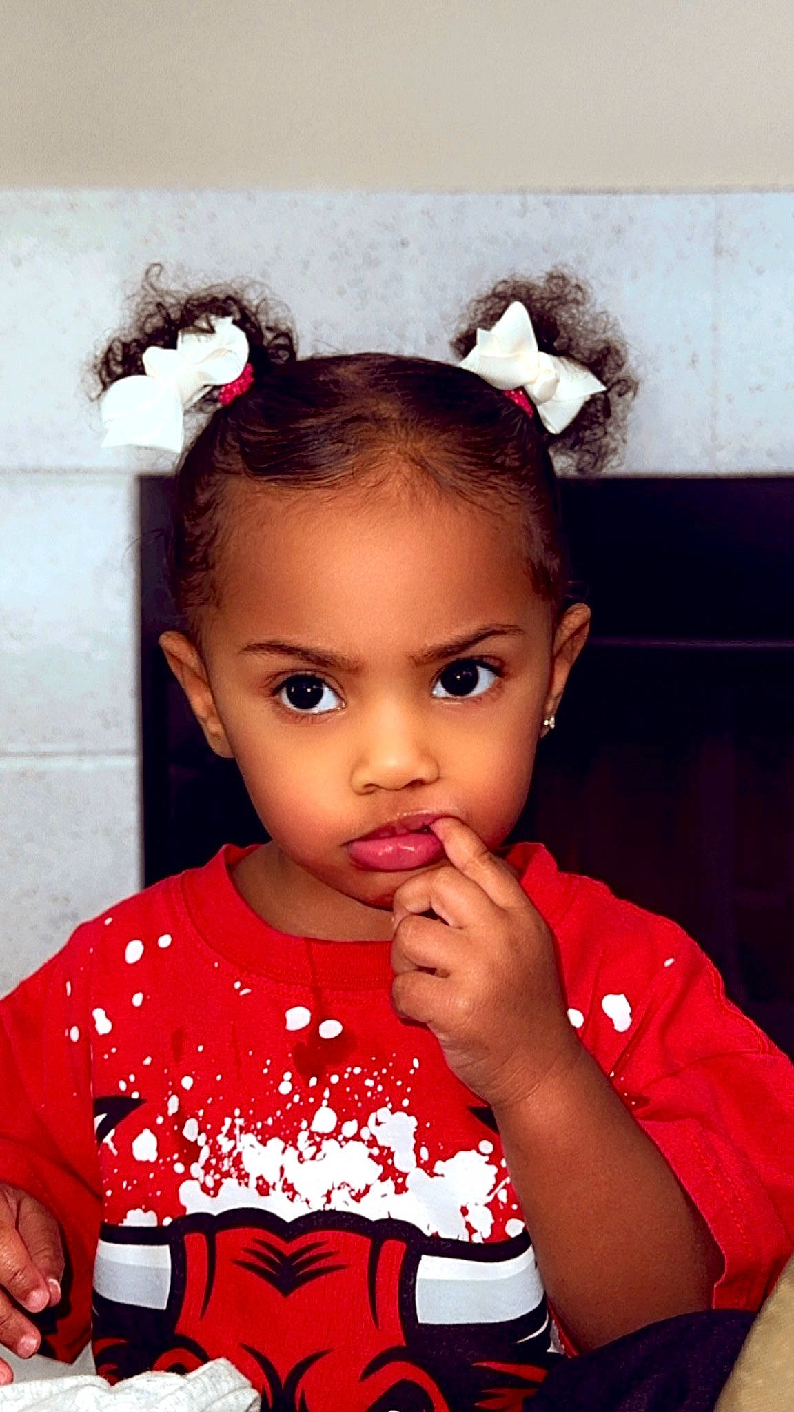 Mila is registered to the contest to win money with this photo: baby_toddler_clothing, black_hair, cheek, child, chin, ear, eyelash, fashion_accessory, flash_photography, hairstyle, happy, head, jewellery, lip, neck, person, pink, skin, sleeve, standing