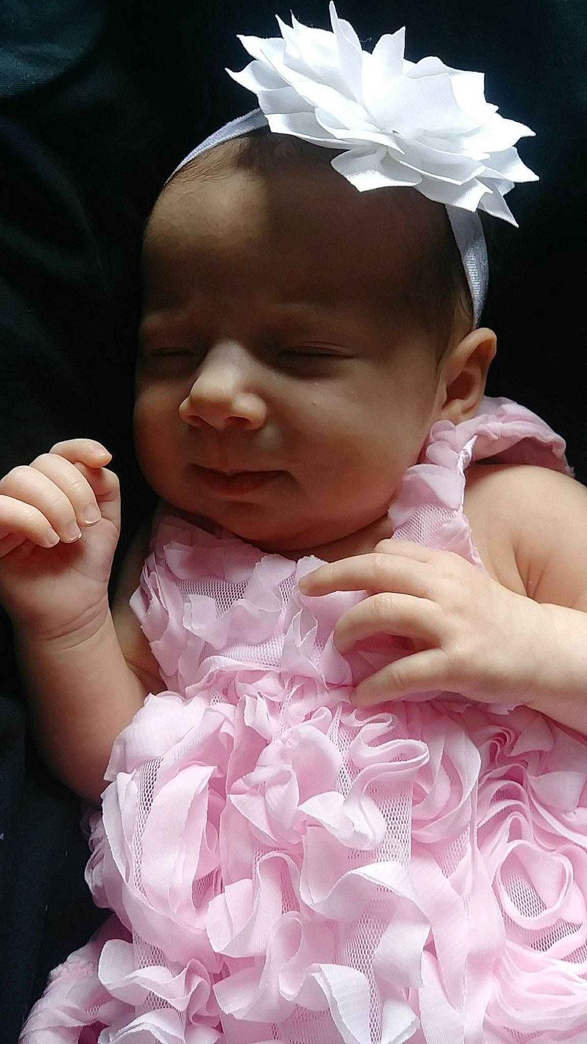 Eleanora is registered to the contest to win money with this photo: baby, cheek, child, fashion_accessory, hair_accessory, hand, headband, headgear, headpiece, mouth, person, petal, pink, skin, toddler