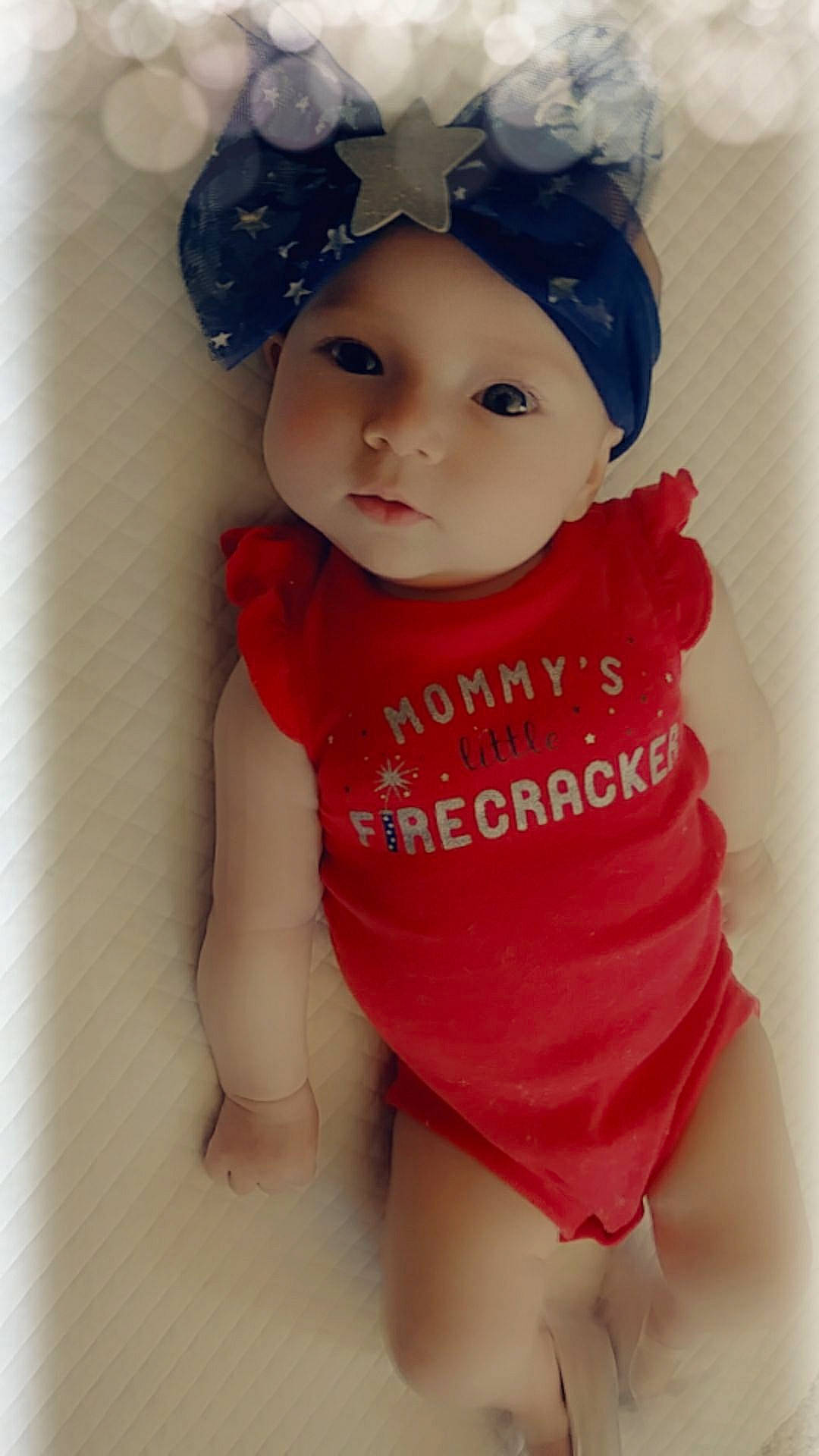 Eleanora is registered to the contest to win money with this photo: baby, baby_products, baby_toddler_clothing, black_hair, brown_hair, cheek, child, doll, headgear, lip, person, pink, product, red, skin, smile, toddler, toy