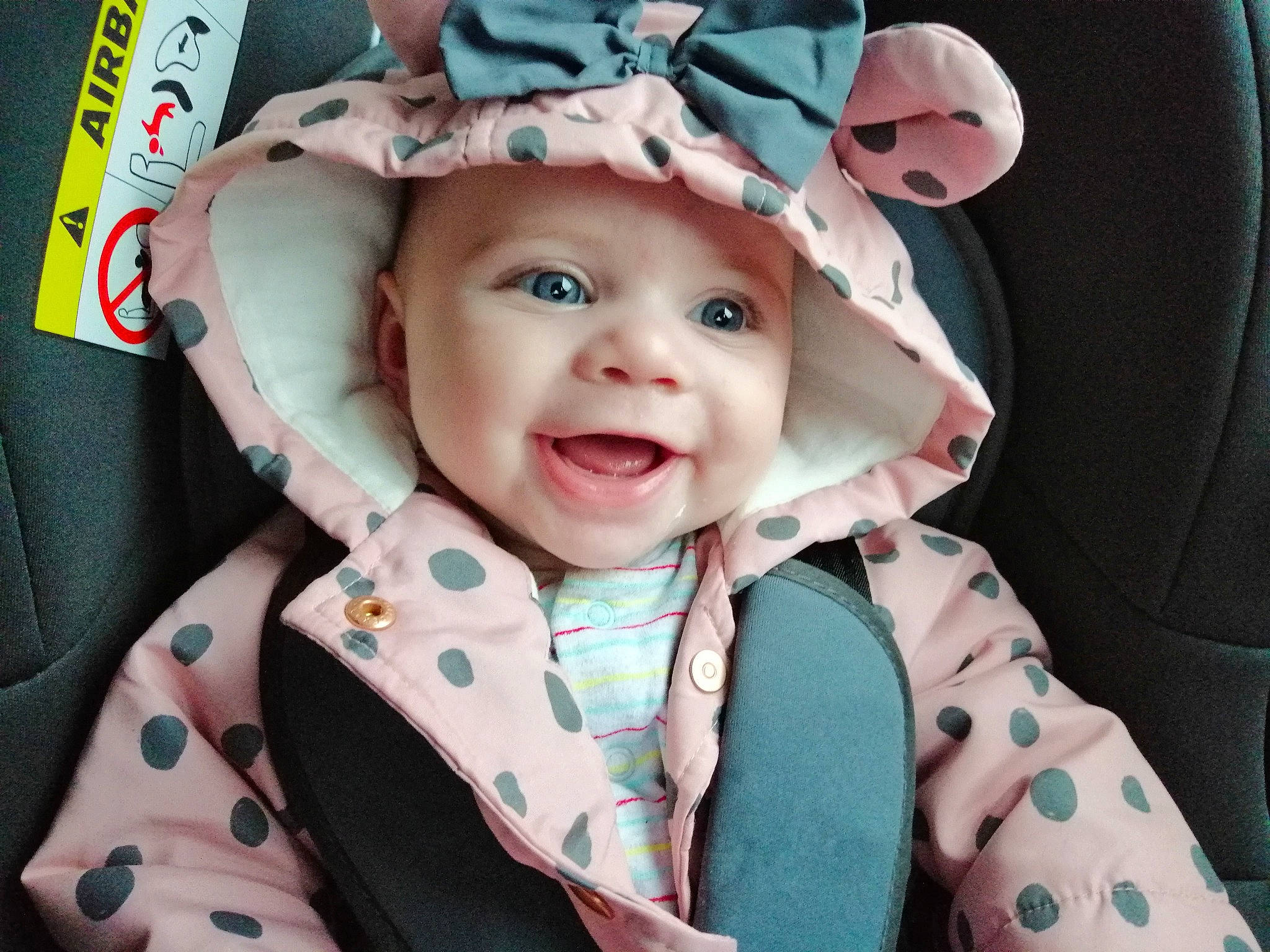 Delilah-rose joined the competition — help win amazing prizes! baby, baby_in_car_seat, car_seat, cheek, child, cool, ear, face, hat, head, headgear, headwear, outerwear, pattern, person, pink, skin, smile, toddler