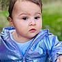 Sarah is registered to the contest to win money with this photo: toddler, child, face, portrait, outdoor, jacket, clothing, curious, expression, young_child, person, nature, greenery, blurred_background, closeup, cute, innocence, baby, skin, young
