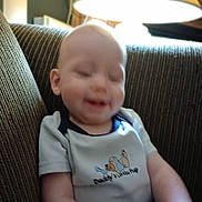Tyberius joined the competition — help win amazing prizes! baby, blurred, casual, child, couch, cozy, cute, furniture, home, indoor, infant, lamp, light, person, relaxing, shirt, sitting, smile, striped_couch, young_child
