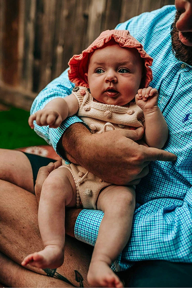 Sutton joined the competition — help win amazing prizes! abdomen, baby, barefoot, blue, child, event, eye, finger, flash_photography, grass, hand, happy, headwear, human_body, human_leg, knee, leisure, person, skin, thigh