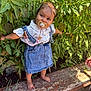Syana a rejoint le concours — aidez-le/la à gagner de superbes lots ! toddler, child, baby, pacifier, denim_dress, barefoot, garden, plants, greenery, outdoor, sunlight, wooden_ledge, nature, cute, smiling, portrait, person, small_child, clothing, summer