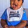 Sevyn is registered to the contest to win money with this photo: toddler, child, happy, smiling, indoor, blue_clothing, headscarf, bib, baby, cute, portrait, hands, face, expression, person, young_child, home, lamp, door, colorful