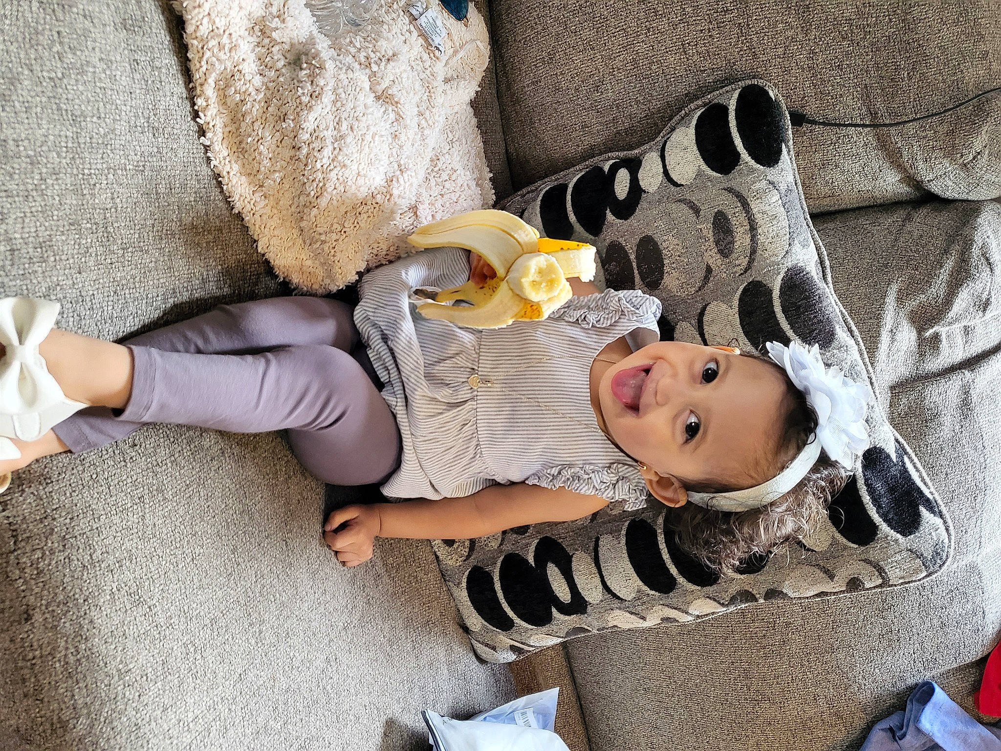 Mikayla is registered to the contest to win money with this photo: baby, baby_carriage, baby_products, baby_sleeping, baby_toddler_clothing, child, comfort, foot, fun, hat, headgear, lap, leg, linens, pattern, person, room, sitting, sock, toddler