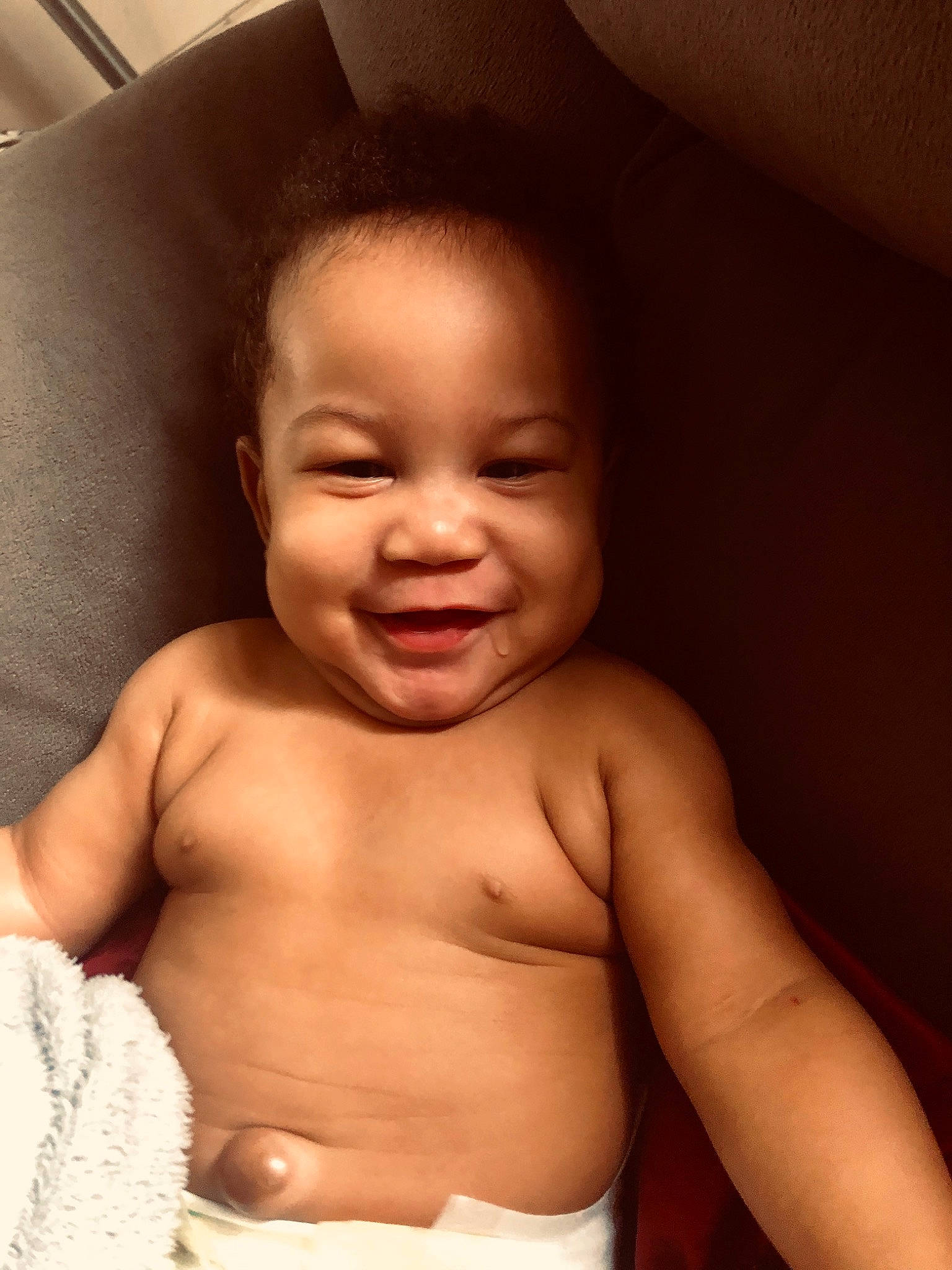 Genesis is registered to the contest to win money with this photo: baby, baby_making_funny_faces, barechested, cheek, child, chin, face, facial_expression, forehead, head, joy, lip, mouth, muscle, nose, person, skin, smile, stomach, toddler
