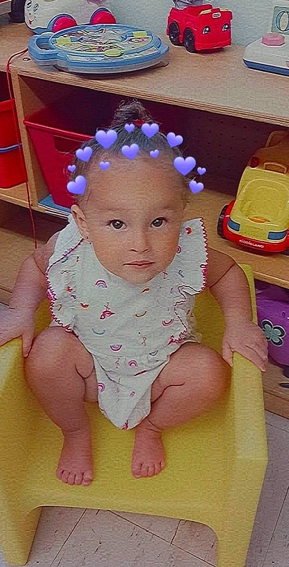 Jaylani joined the competition — help win amazing prizes! baby, baby_products, baby_toddler_clothing, cheek, child, fashion_accessory, finger, flooring, fun, hair_accessory, happy, headband, headpiece, nail, person, pink, sitting, skin, textile, thumb