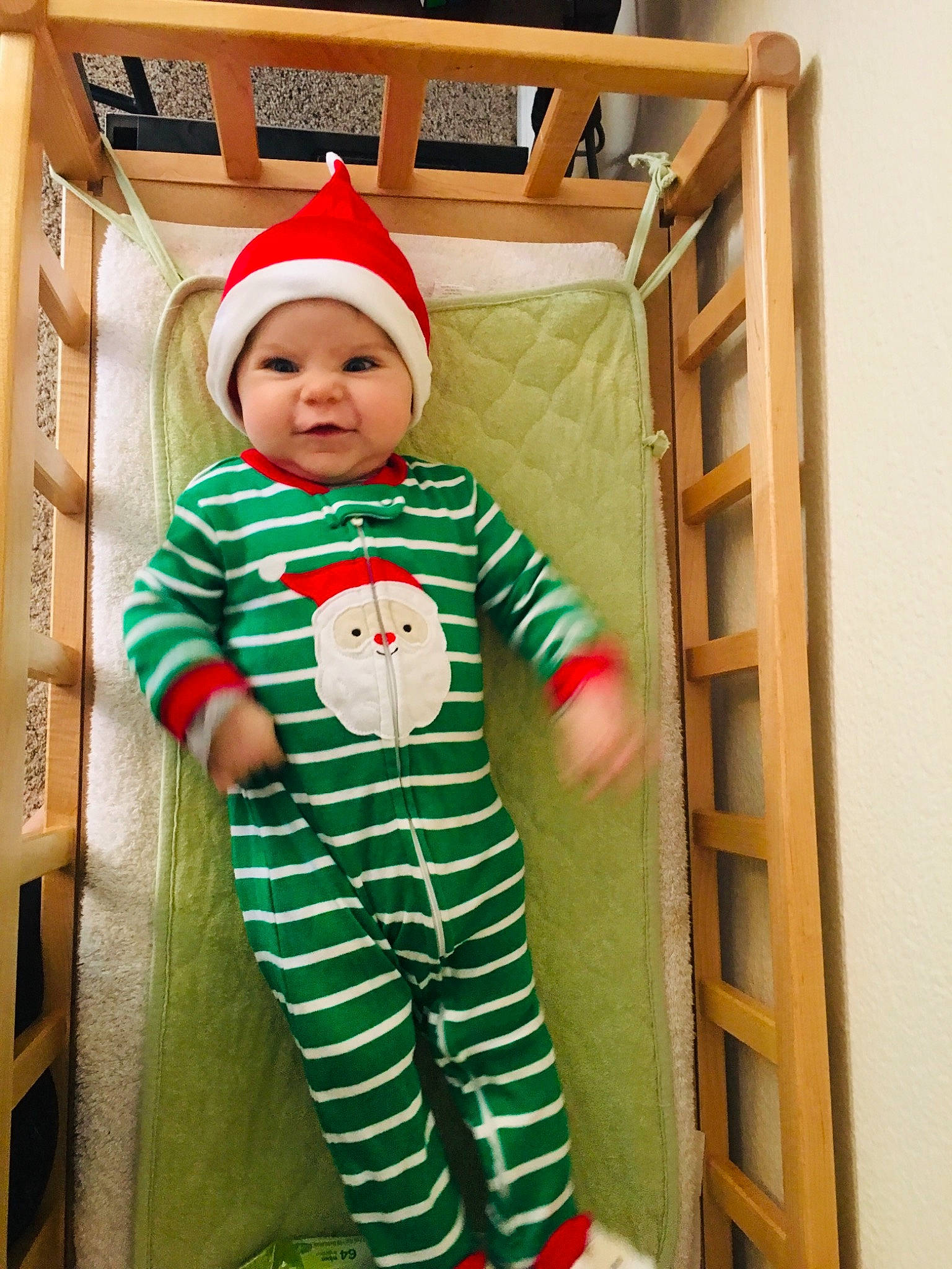 Lilian is registered to the contest to win money with this photo: baby_products, child, christmas, christmas_stocking, costume, headwear, holiday, infant, outerwear, pattern, person, play, product, red, smile, textile, toddler, toy