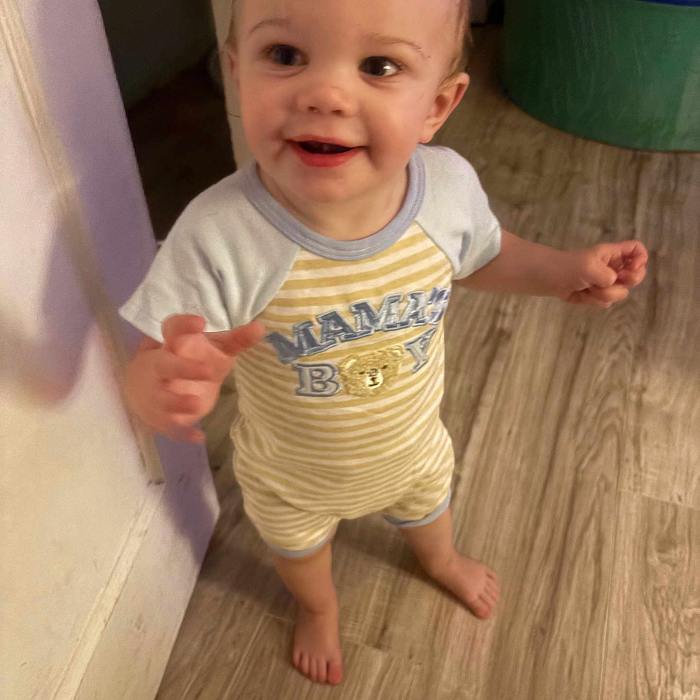Hayden joined the competition — help win amazing prizes! toddler, child, smiling, barefoot, indoor, wooden_floor, onesie, clothing, standing, happy, face, person, baby, cute, home, flooring, doorframe, playroom, bright_eyes, striped_clothing