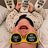 Joseph joined the competition — help win amazing prizes! baby, infant, smiling, sunglasses, bottle, pajamas, footwear, text, happy, cheerful, lying_down, indoors, bed, child, cute, playful, face, person, clothing, funny