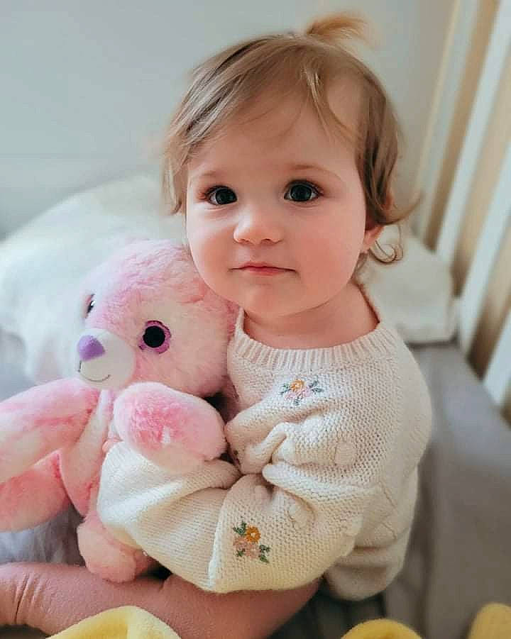 Scarlett is registered to the contest to win money with this photo: baby, baby_toddler_clothing, cheek, child, comfort, eye, foot, happy, lip, nose, person, pink, sitting, skin, sleeve, sock, stuffed_toy, teddy_bear, toddler, toy