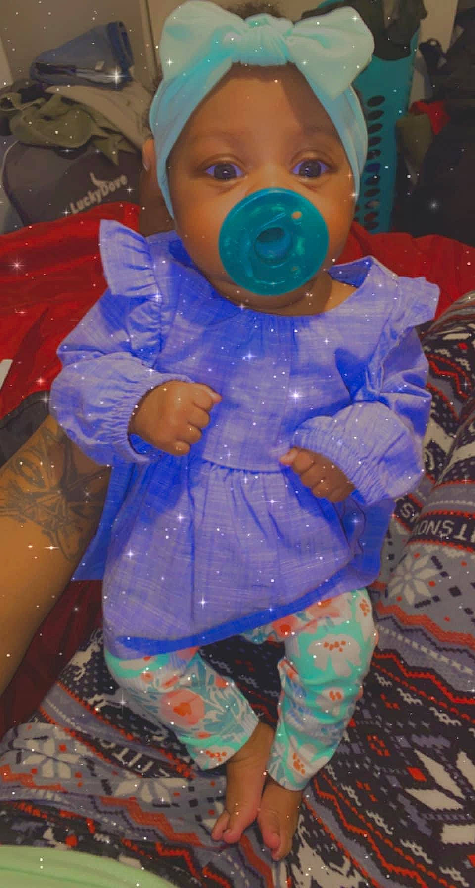 Kaylani is registered to the contest to win money with this photo: baby, baby_products, baby_toddler_clothing, cheek, child, costume, electric_blue, eye, face, fun, happy, outerwear, pattern, person, personal_protective_equipment, pink, plastic, purple, sleeve, toddler