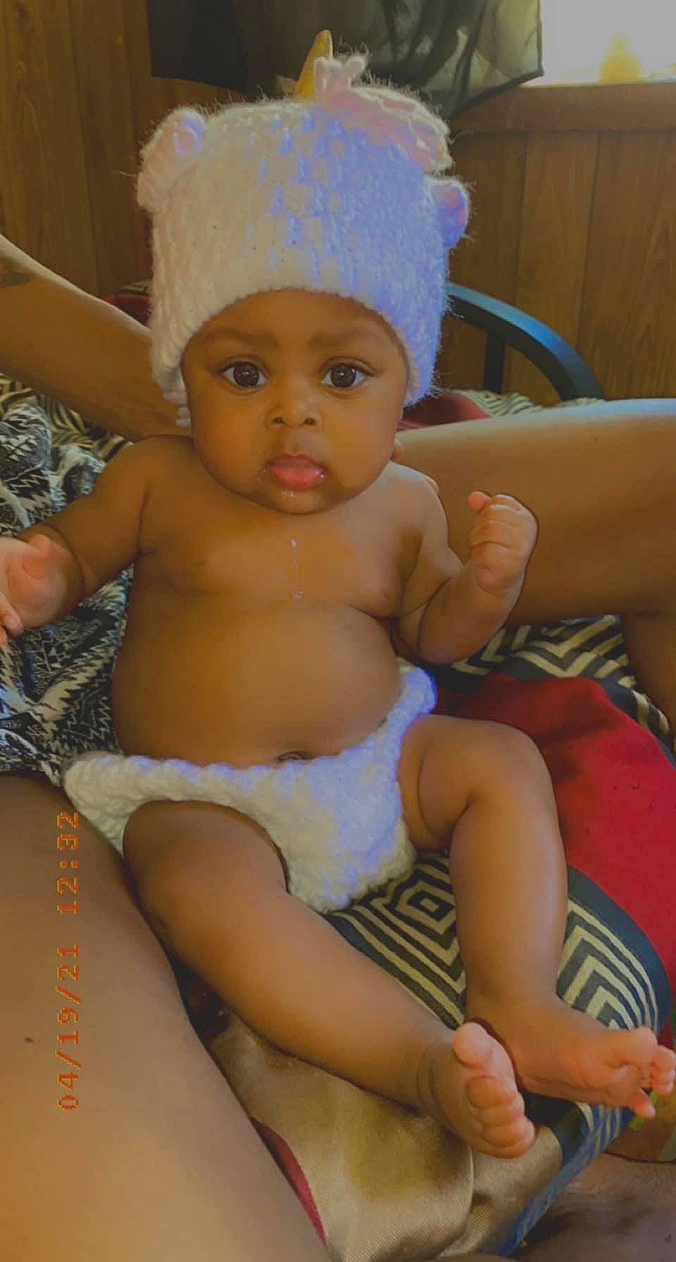 Kaylani joined the competition — help win amazing prizes! abdomen, arm, baby, cap, cheek, chest, comfort, facial_expression, finger, fun, happy, head, headwear, knee, leg, mammal, person, skin, thigh, thumb