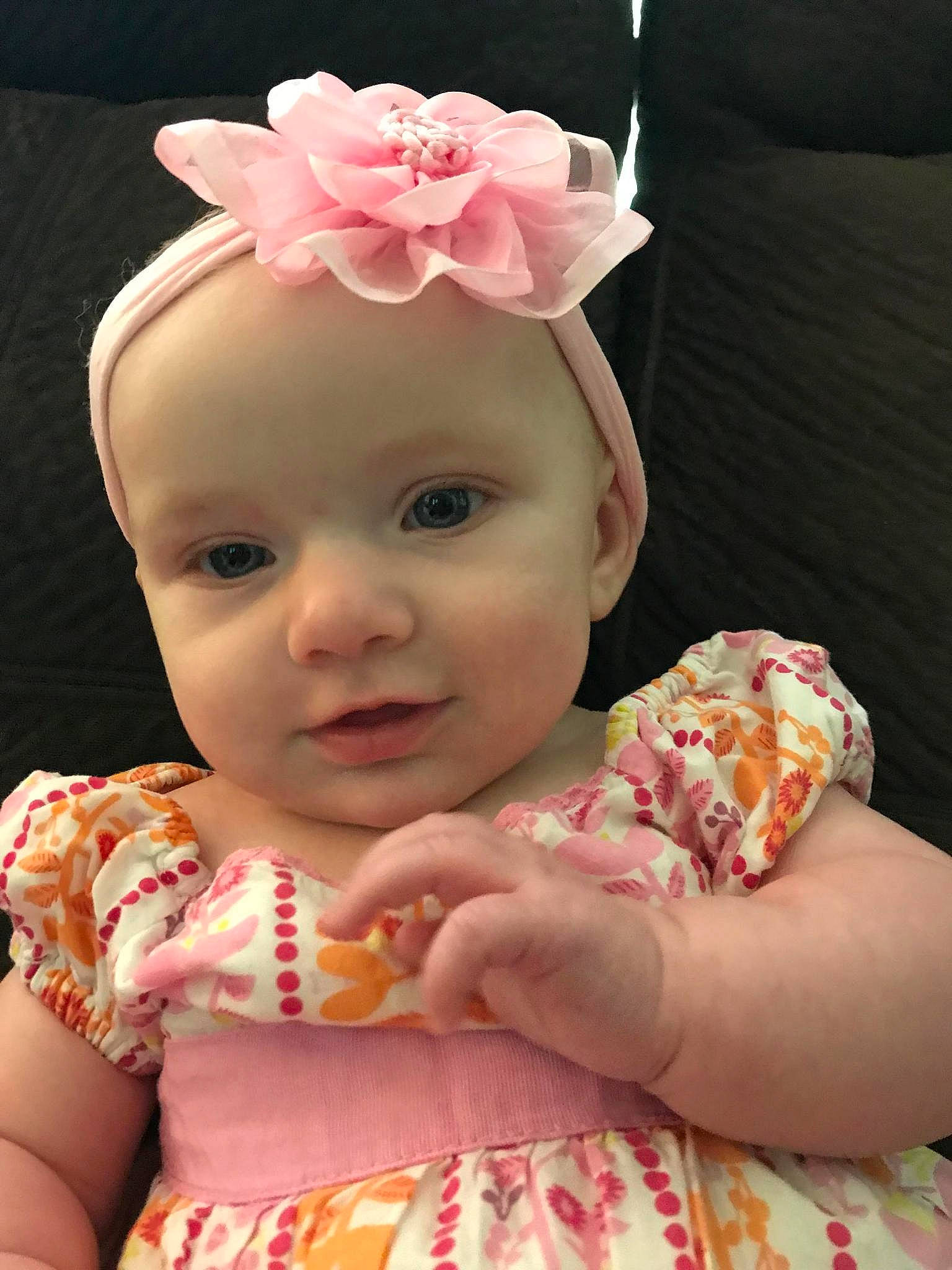 Ava-marie is registered to the contest to win money with this photo: baby, baby_toddler_clothing, cheek, child, ear, face, fashion_accessory, hair_accessory, head, headband, headgear, person, pink, textile, toddler
