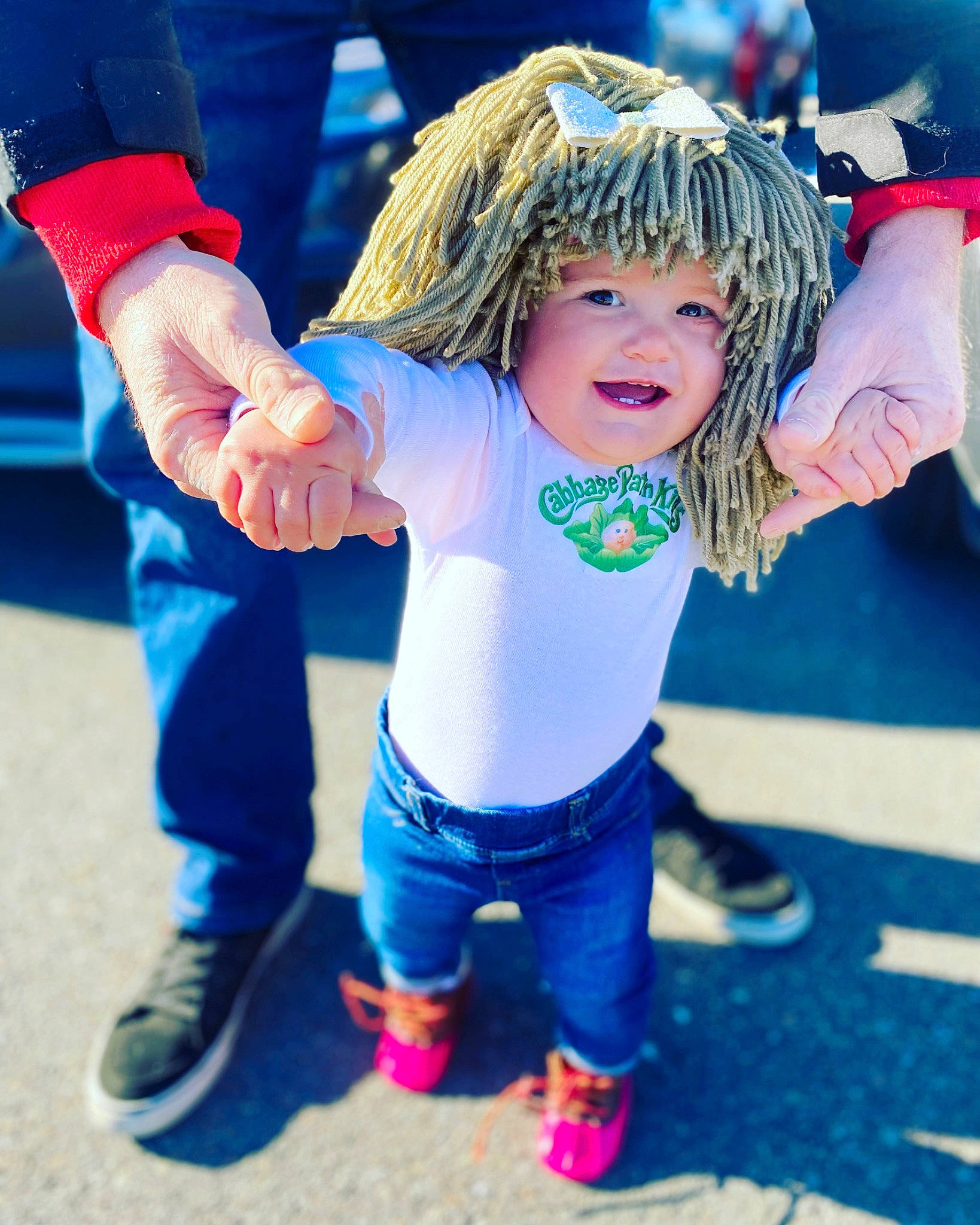 Cali joined the competition — help win amazing prizes! blond, child, cool, electric_blue, event, facial_expression, footwear, fun, gesture, grass, happy, headwear, leisure, people, person, recreation, sandal, shoe, sleeve, smile