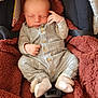 baby, newborn, sleeping, infant, car_seat, blanket, clothing, cute, cozy, indoor, child, soft, warm, peaceful, small, bundle, resting, portrait, hands, feet