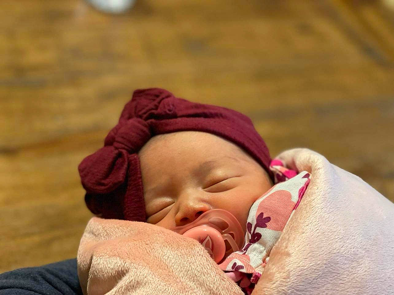 Audriana is registered to the contest to win money with this photo: baby, baby_products, baby_sleeping, baby_toddler_clothing, bedtime, cap, cheek, child, comfort, eye, face, happy, headgear, headwear, linens, lip, mouth, neck, nose, person