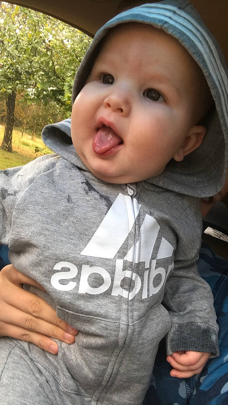 Elliott joined the competition — help win amazing prizes! baby, cheek, child, chin, cool, face, facial_expression, lip, nose, outerwear, person, sitting, skin, smile, toddler