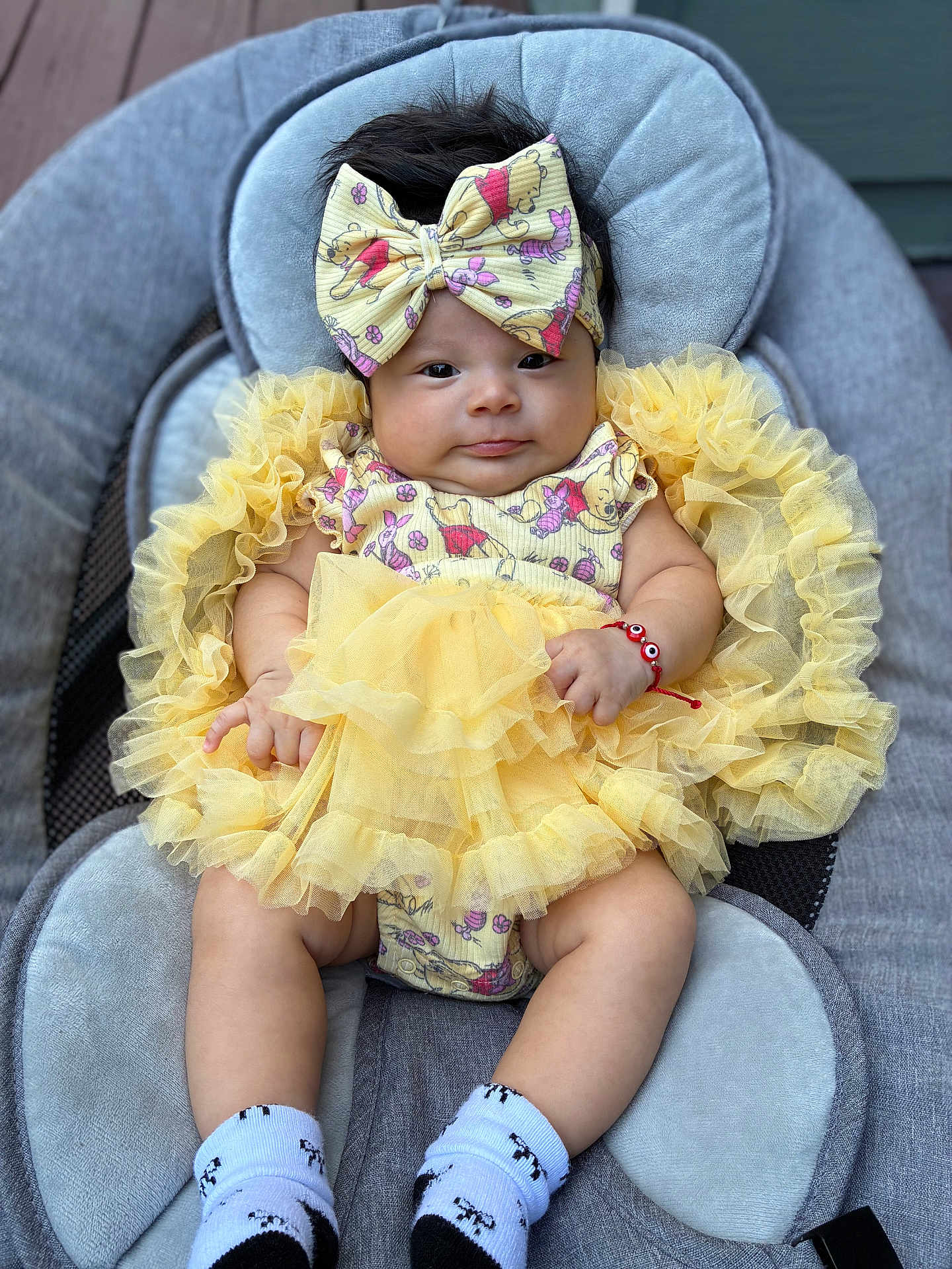 Stephanie joined the competition — help win amazing prizes! baby, infant, child, dress, headband, yellow, ruffles, socks, panda, seat, cushion, cute, adorable, portrait, indoor, clothing, bracelet, hands, legs, face