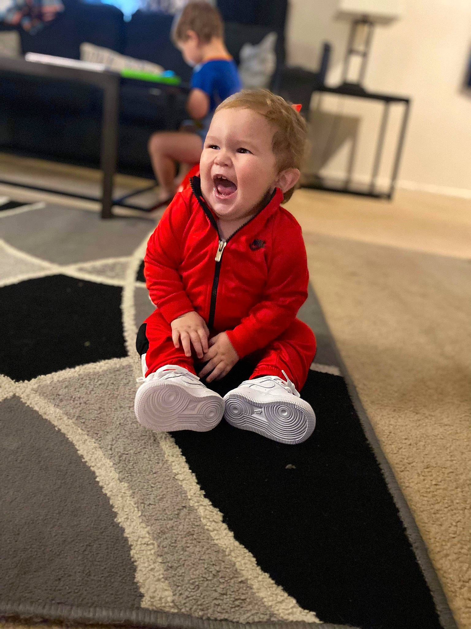 Bryson joined the competition — help win amazing prizes! asphalt, baby, baby_toddler_clothing, carpet, child, clothing, floor, flooring, fun, happy, hardwood, human_leg, leisure, person, sitting, sleeve, smile, snapshot, standing, toddler