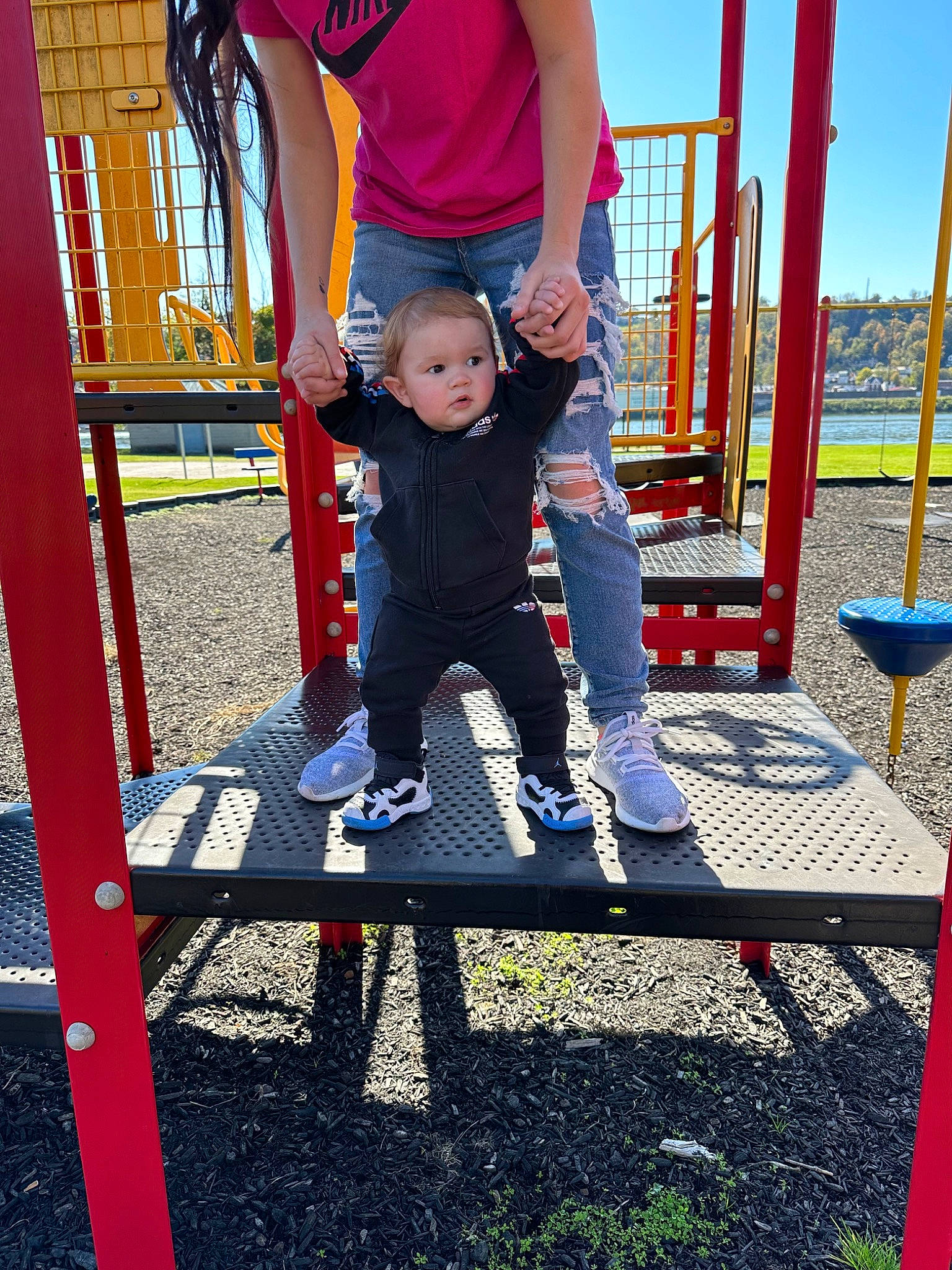 Bryson is registered to the contest to win money with this photo: baby, blue, child, city, electric_blue, fun, grass, happy, leisure, magenta, outdoor_furniture, outdoor_play_equipment, people_in_nature, person, play, playground, recreation, shorts, sitting, sky