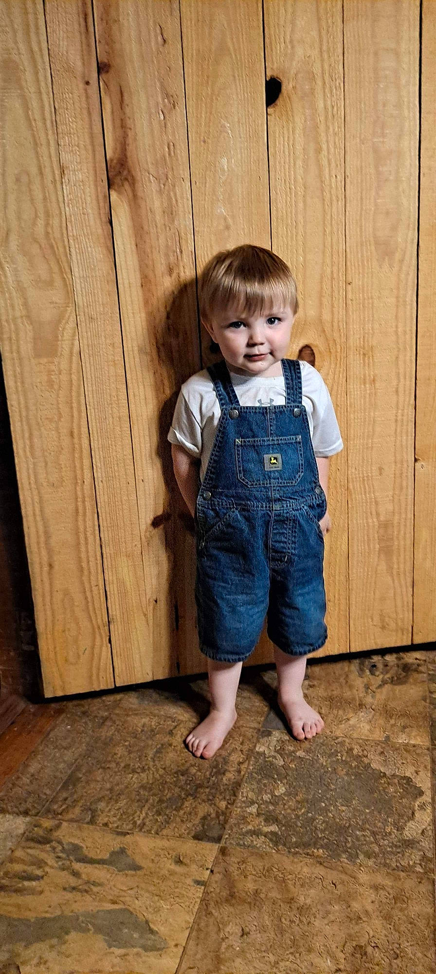 Jaxson is registered to the contest to win money with this photo: baby_toddler_clothing, button, chin, clothing, collar, denim, dress, dress_shirt, eye, flooring, leg, outerwear, pattern, person, skin, sleeve, standing, t_shirt, toddler, waist