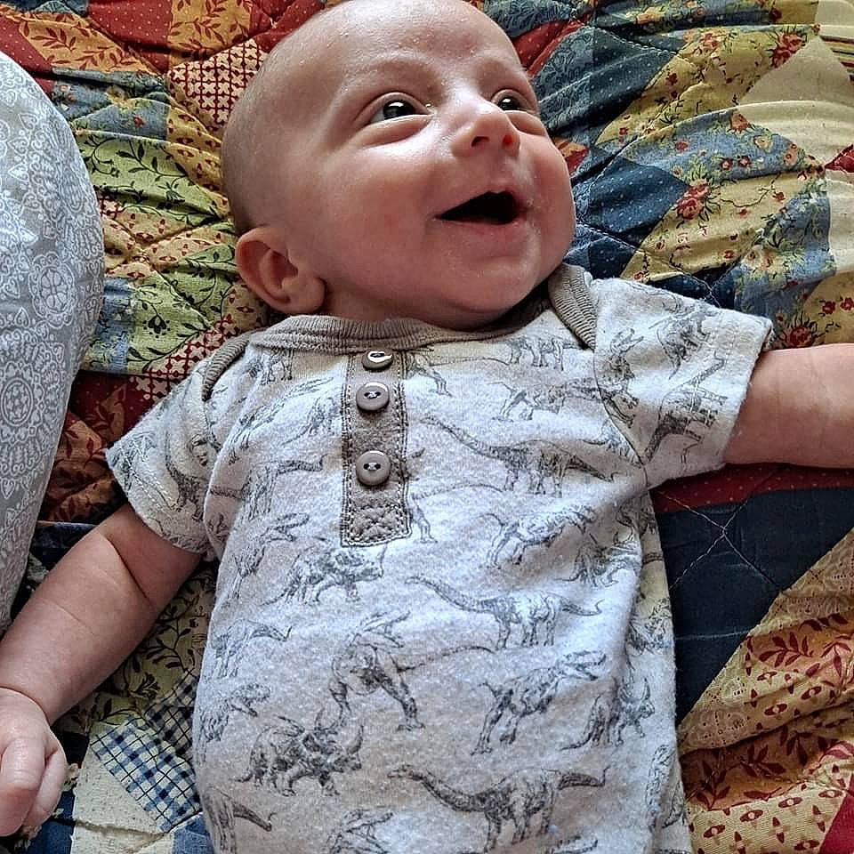 Jase joined the competition — help win amazing prizes! baby, baby_toddler_clothing, cheek, cool, eye, grass, happy, head, iris, lip, mouth, nose, pattern, person, pink, skin, sleeve, smile, t_shirt, textile