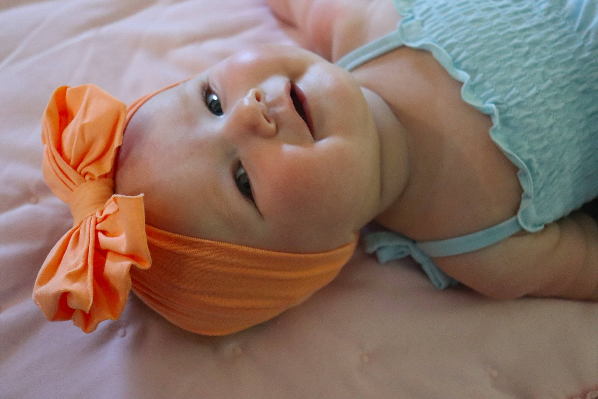 Kennedy Rose Ferrell is registered to the contest to win money with this photo: baby, baby_products, baby_sleeping, baby_toddler_clothing, bedtime, cheek, comfort, fashion_accessory, finger, hair_accessory, hand, happy, hat, headwear, linens, nail, nose, peach, person, petal