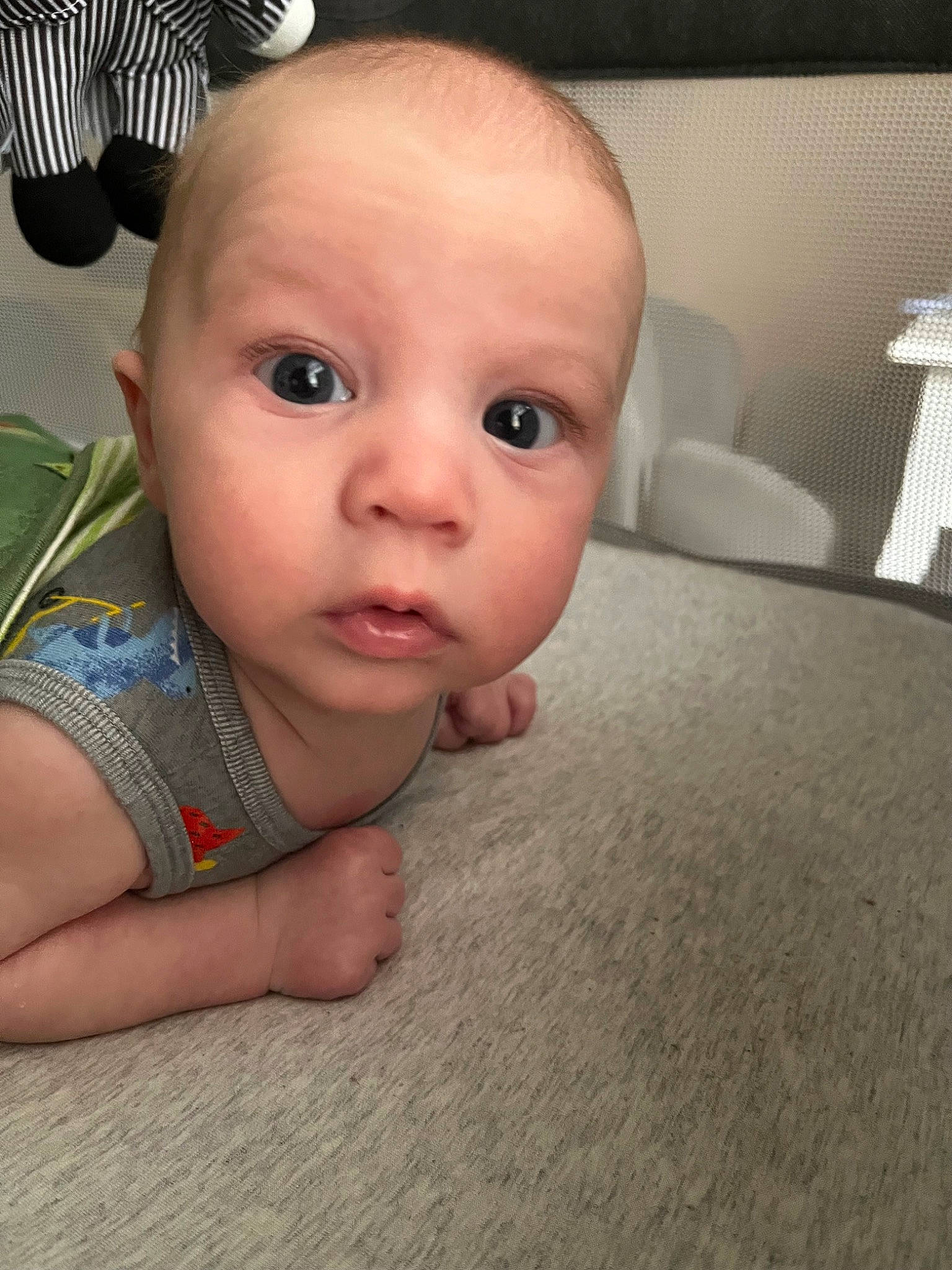 Collin is registered to the contest to win money with this photo: audio_equipment, baby, baby_toddler_clothing, cheek, child, comfort, eyelash, finger, flash_photography, floor, flooring, iris, mechanical_fan, nail, nose, person, sitting, skin, thumb, toddler