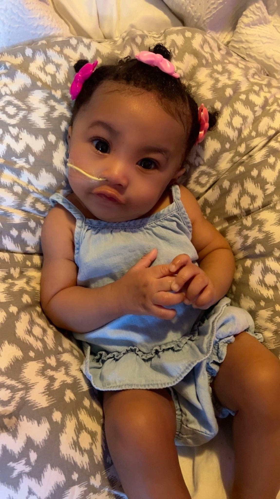 Wynter is registered to the contest to win money with this photo: baby, baby_toddler_clothing, cheek, child, eye, face, grass, hair, happy, head, human_body, human_leg, iris, lip, person, pink, skin, textile, thigh, toddler