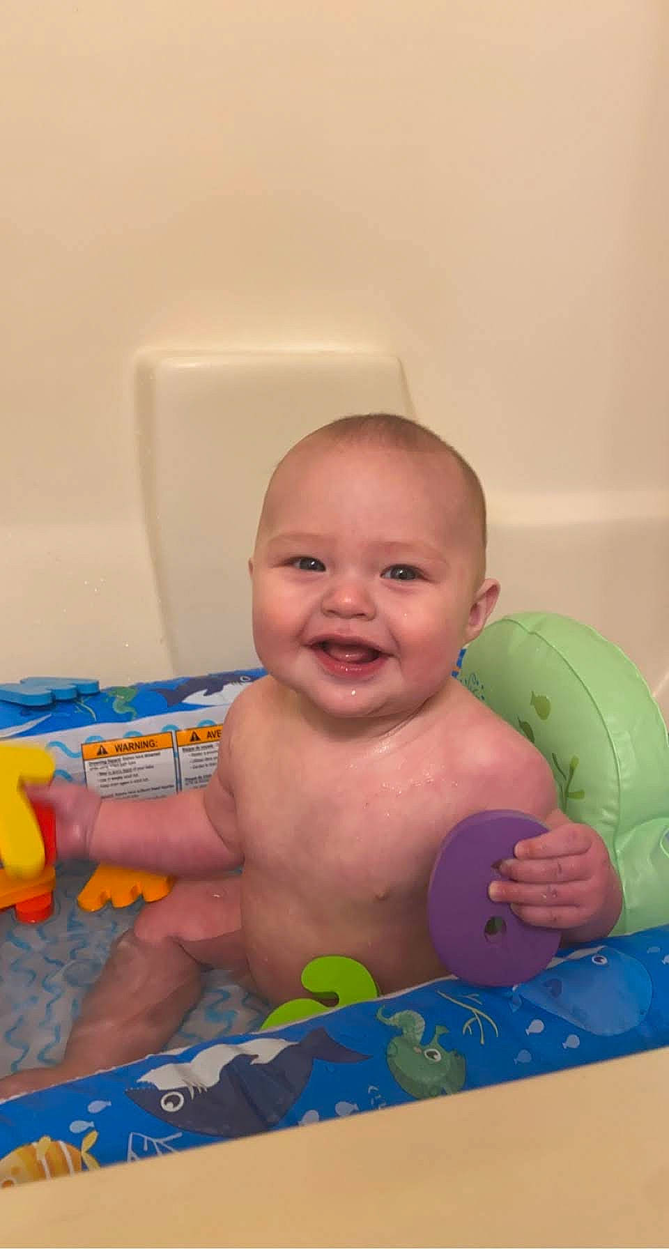 Gatlin is registered to the contest to win money with this photo: baby, baby_bathing, baby_playing_with_toys, baby_products, baby_toddler_clothing, baby_toys, bathing, blue, cheek, chest, child, facial_expression, finger, fun, joint, joy, muscle, organ, person, product