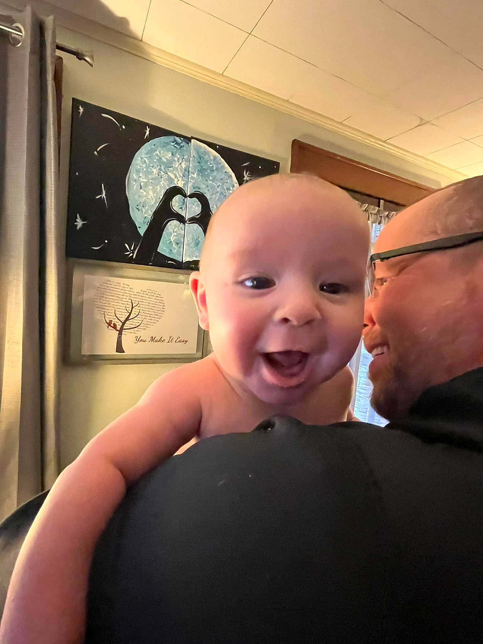 Elijah is registered to the contest to win money with this photo: baby, ceiling, cheek, child, comfort, eyewear, finger, flooring, fun, gesture, happy, mouth, nose, person, room, shoulder, sitting, smile, thumb, toddler
