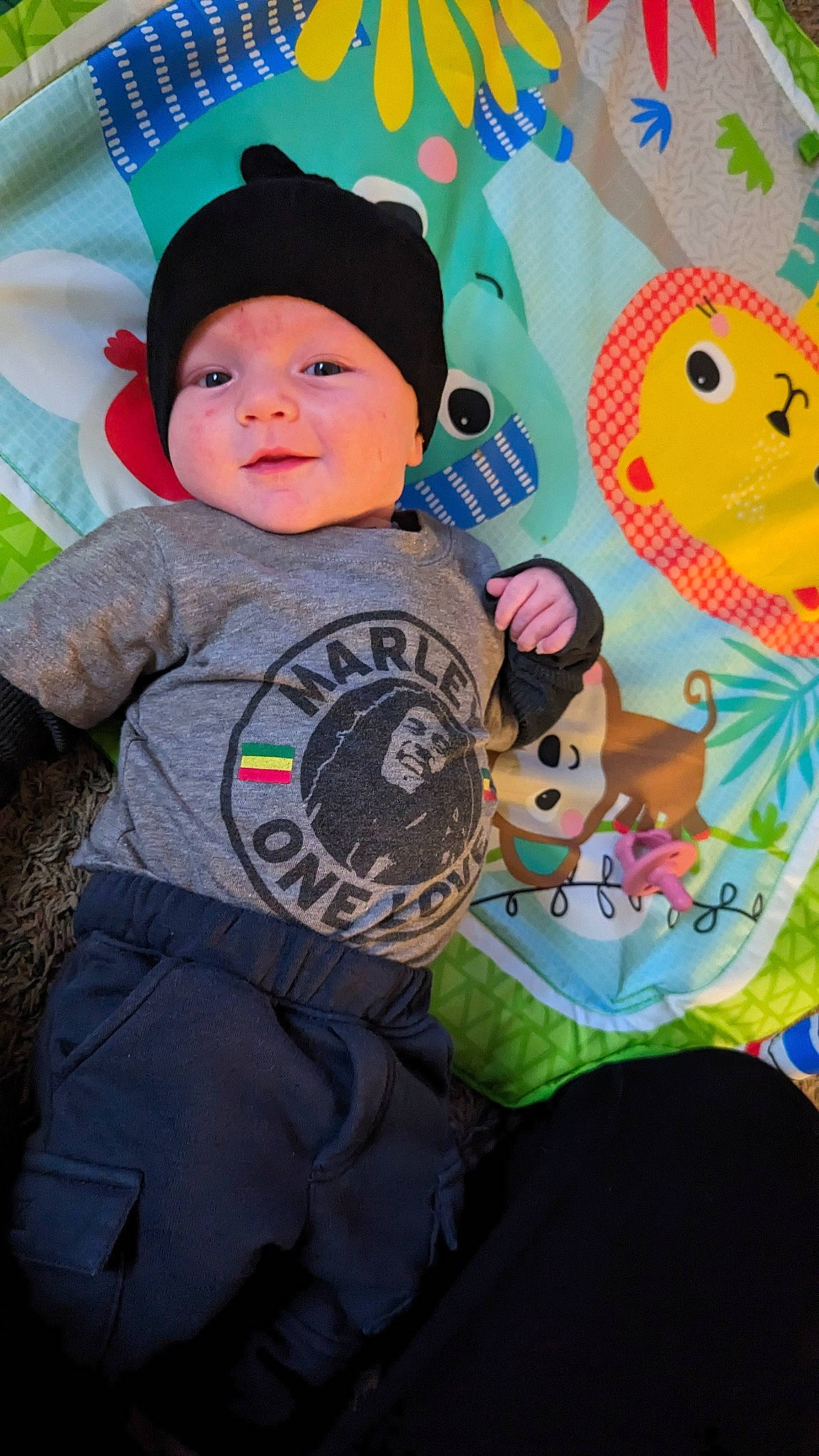 Sebastian is registered to the contest to win money with this photo: art, baby, baby_toddler_clothing, baseball_cap, beanie, cap, child, facial_expression, fun, happy, headgear, headwear, pattern, people, person, personal_protective_equipment, pink, t_shirt, textile, toddler