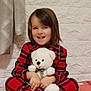 barefoot, blanket, caucasian, child, curtain, cute, happy, home, indoors, pajamas, person, pink, plaid, portrait, sitting, smiling, soft_toy, teddy_bear, toy, wall