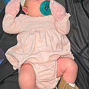 Everleigh joined the competition — help win amazing prizes! baby, sleeping, pacifier, pink_clothing, mittens, headband, booties, blanket, indoor, infant, cute, resting, newborn, soft_fabric, cozy, person, child, toddler, footwear, bed