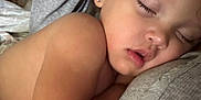 Rosilee is registered to the contest to win money with this photo: bed, blanket, child, closeup, comfort, cuddle, earring, face, hand, human, indoor, nail_art, nap, peaceful, portrait, rest, skin, sleeping, soft_light, toddler