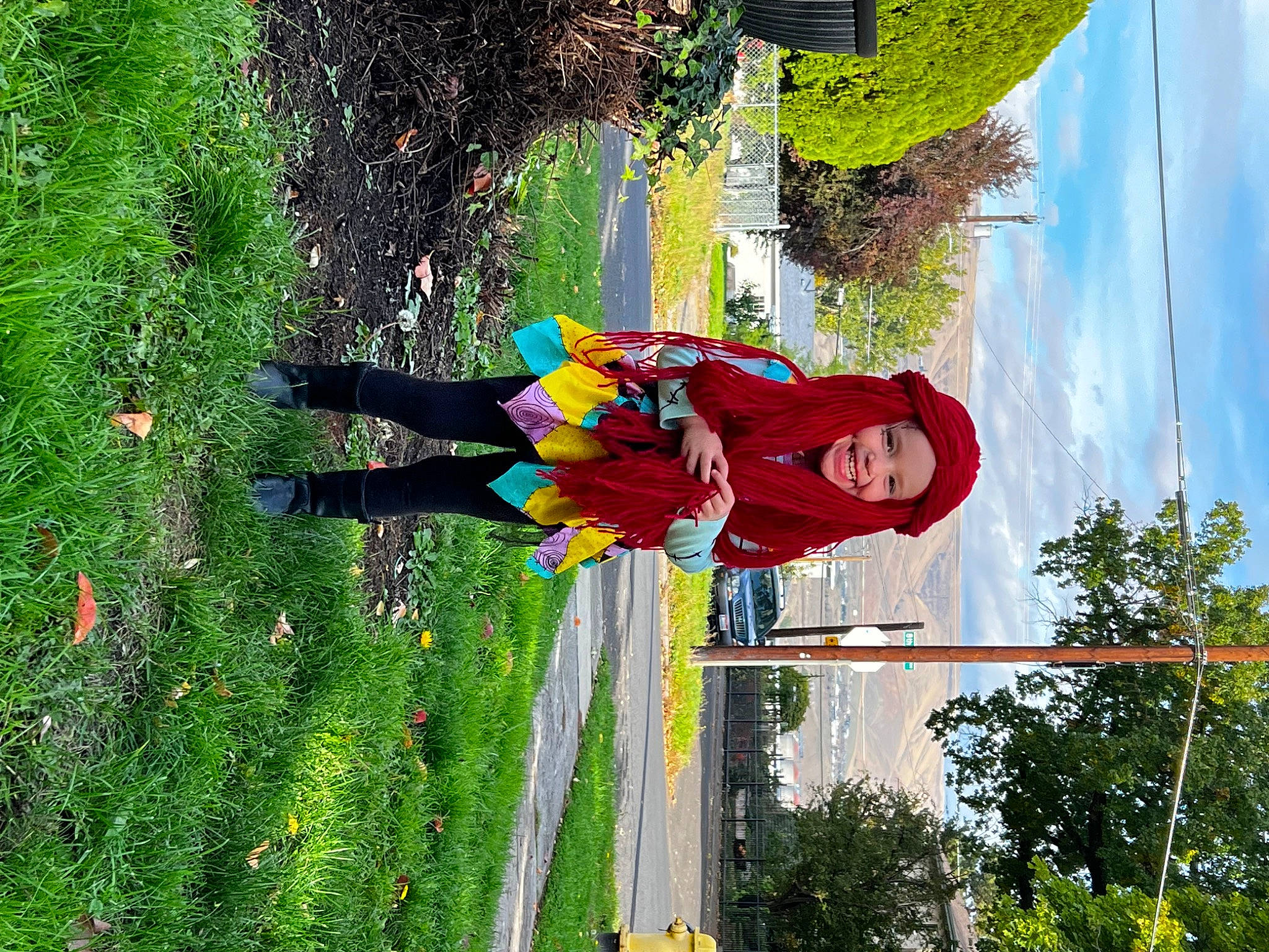 Harper is registered to the contest to win money with this photo: cloud, flower, fun, grass, green, headwear, joy, leisure, people_in_nature, person, plant, pole, shrub, sky, toddler, tree, walking_shoe, window, yellow