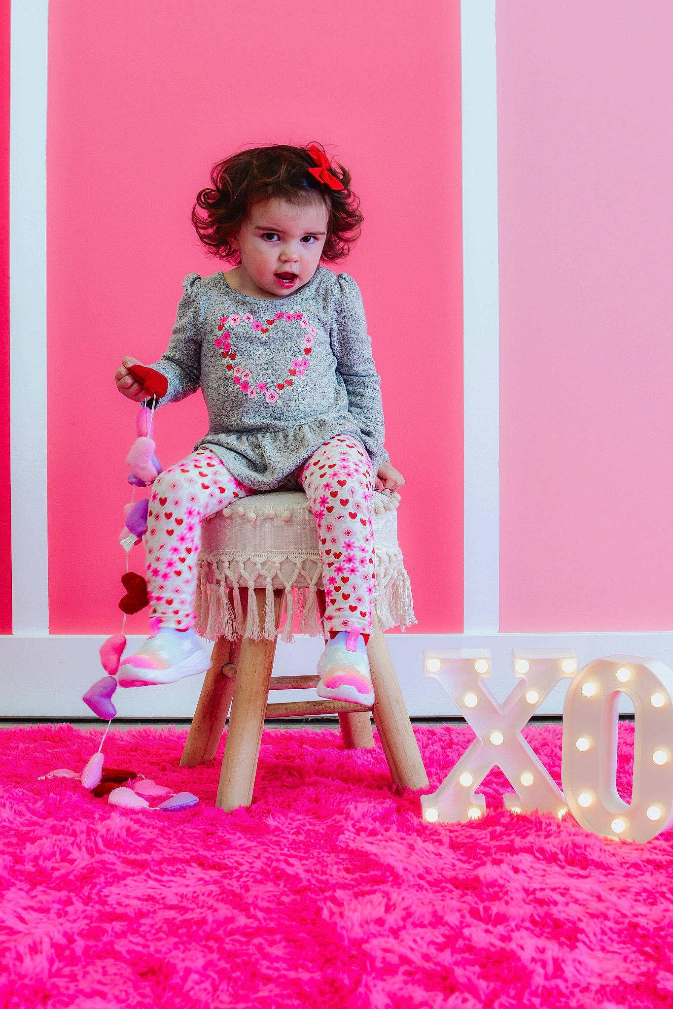 Evelyn joined the competition — help win amazing prizes! baby_toddler_clothing, clothing, day_dress, dress, event, fashion_design, fun, happy, human_leg, leisure, magenta, one_piece_garment, pattern, peach, person, pink, purple, sitting, sleeve, toddler