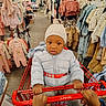 toddler, child, shopping_cart, jcpenny, clothing_store, baby_clothes, jacket, hat, hands, rack, retail, indoor, shopping, winter_clothing, person, store_aisle, coat, warm_clothing, cute, baby