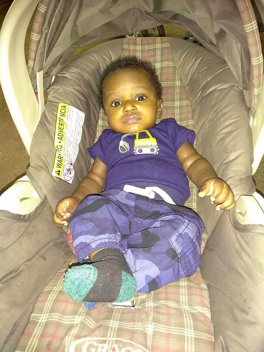 Kendrick is registered to the contest to win money with this photo: baby_products, car_seat, child, cool, eye, fun, girl, infant, person, play, product, purple, sitting, skin, toddler