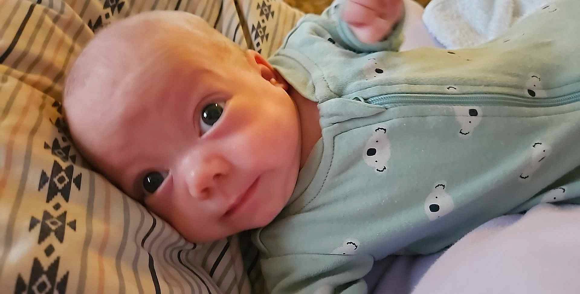 Mathew is registered to the contest to win money with this photo: baby, baby_toddler_clothing, cheek, child, chin, close_up, comfort, eye, eyebrow, grass, happy, iris, lip, mouth, nose, person, skin, sleeve, smile, toddler