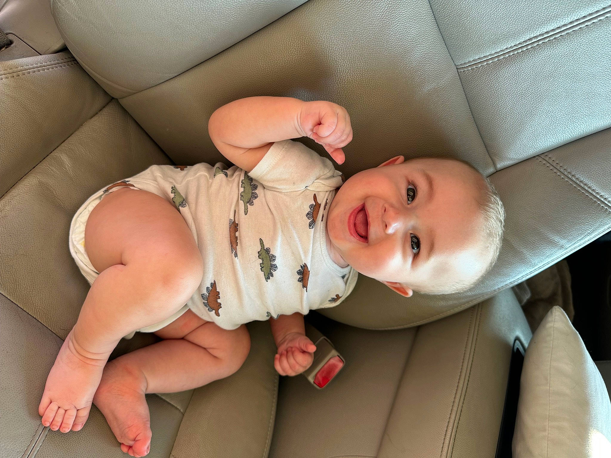 Benjamin is registered to the contest to win money with this photo: baby, baby_toddler_clothing, cheek, child, comfort, dress, eye, finger, grass, hand, happy, human_body, joy, lip, mammal, mouth, nose, person, product, skin