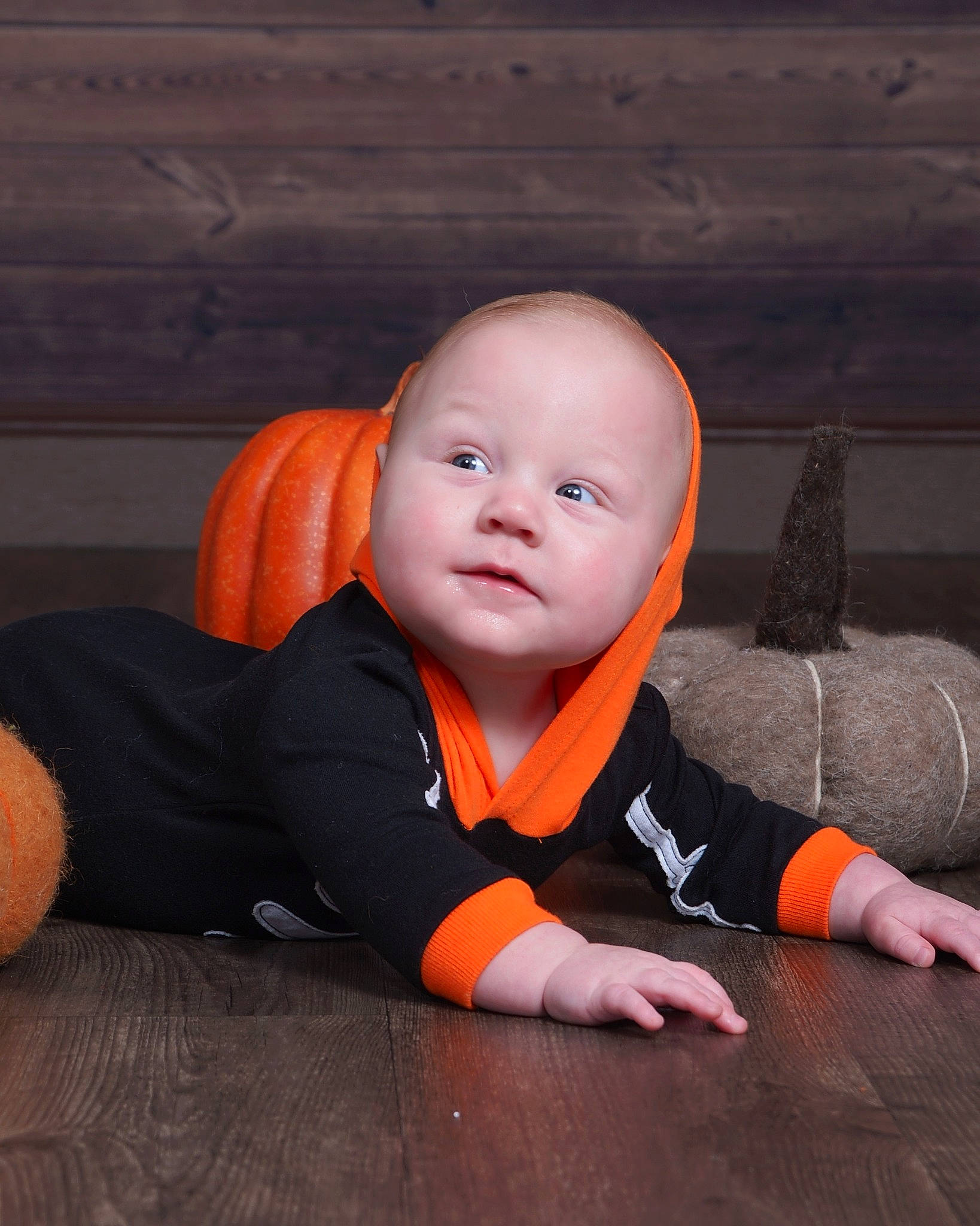 Graysen is registered to the contest to win money with this photo: baby, baby_toddler_clothing, calabaza, child, comfort, flash_photography, floor, flooring, fun, happy, hardwood, orange, person, pumpkin, sitting, smile, thumb, toddler, vegetable, wood